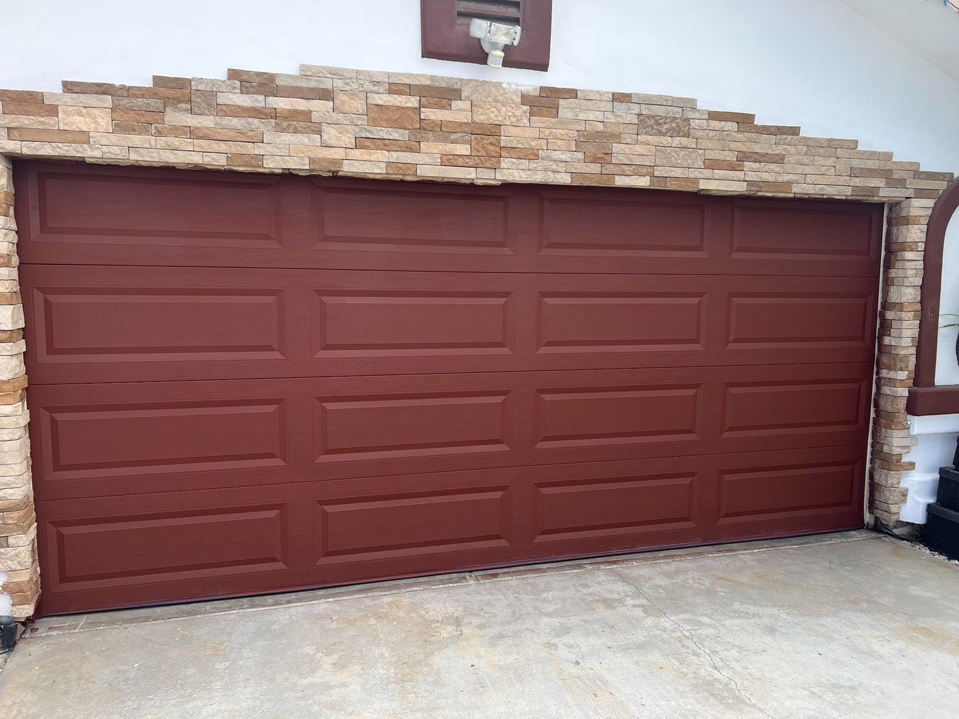 Freshly painted garage door by G&P Property Solutions